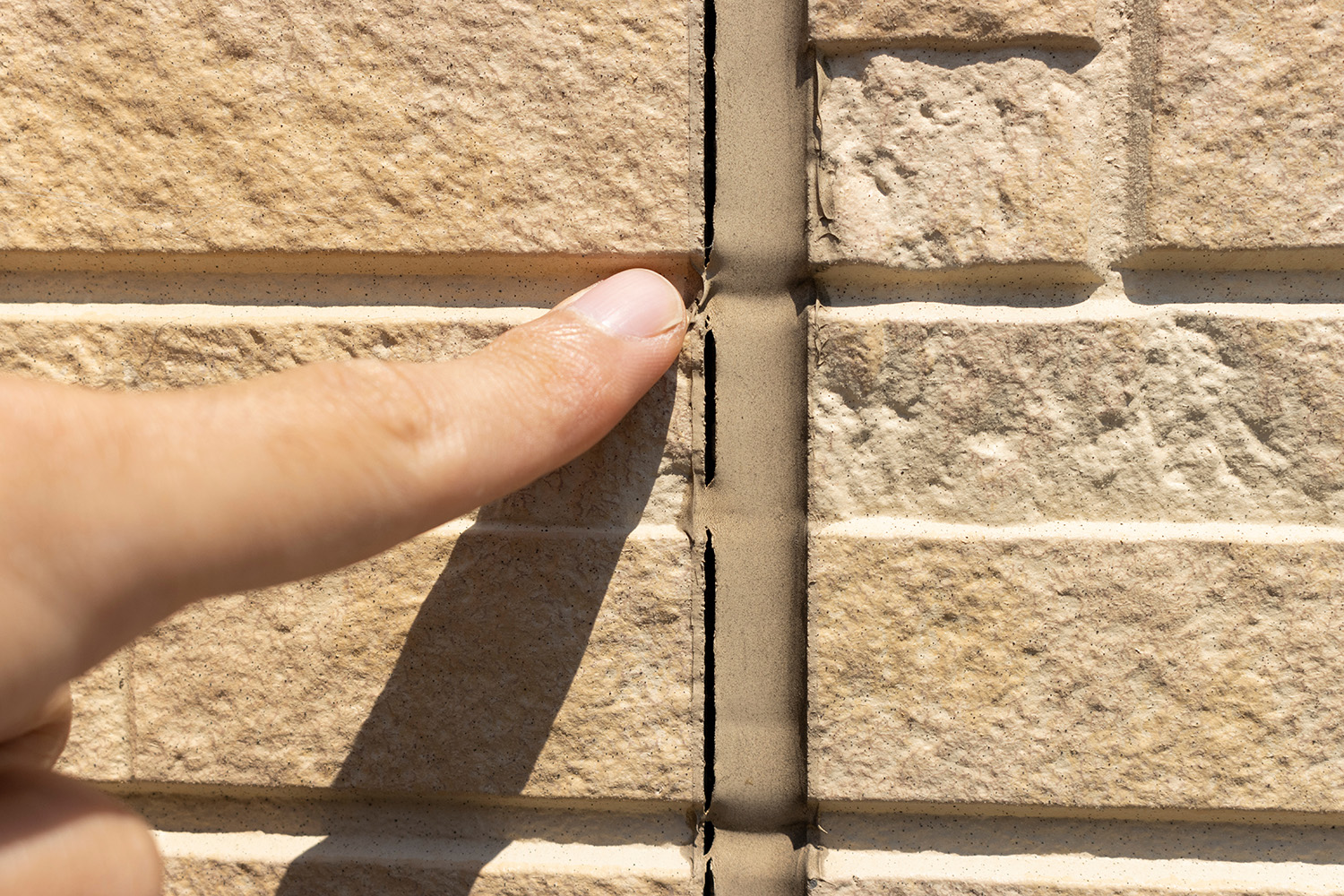 Split sealant on exterior wall.