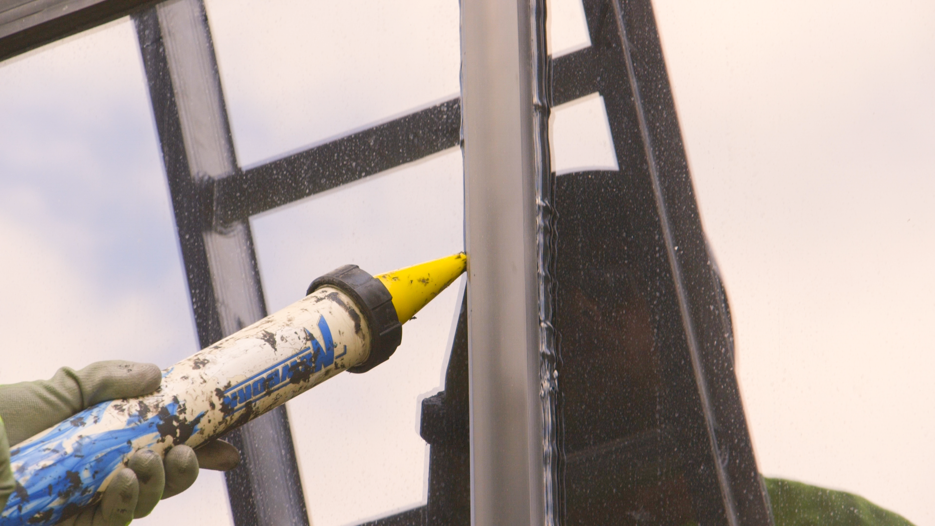 Glazing sealant application on window joint.