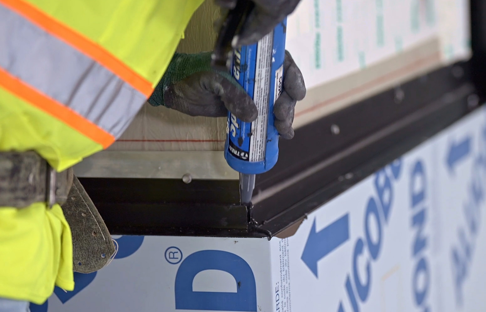 Sealant application on metal.